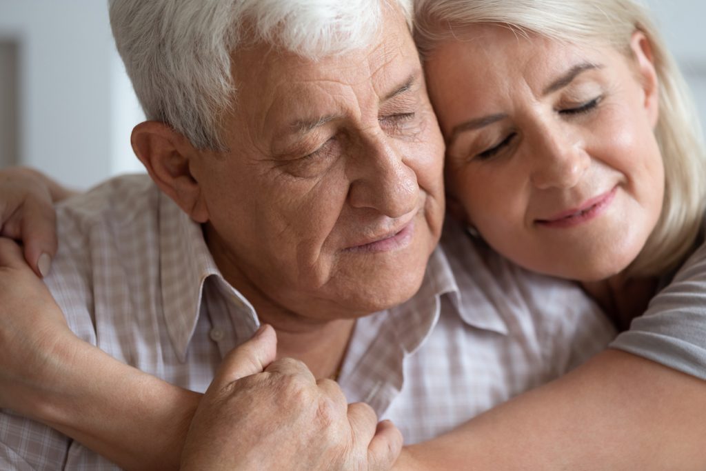 An older man and his daughter share a tender, yet somber, embrace. At DaySpring, our senior care services are supported by over 30 years of experience.